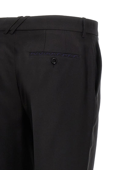 Trousers by Burberry for men in virgin wool & silk black features a sculptural silhouette, showcasing a sculptural and long with a sophisticated for a sculptural finish.