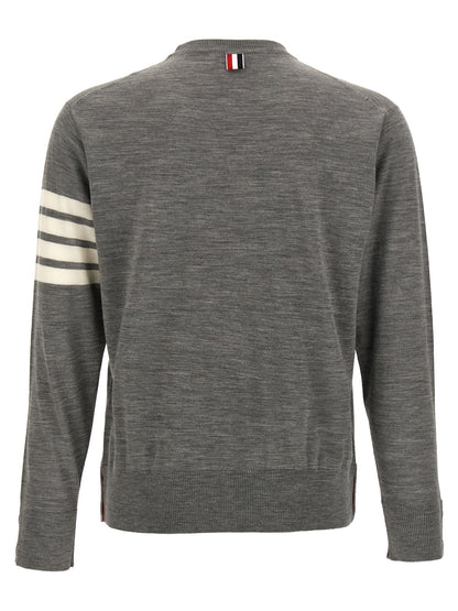 Cardigan by Thom Browne for men in virgin wool gray showcases a captivating silhouette, artfully detailed with a captivating and crew neckline for a truly sophisticated captivating look.