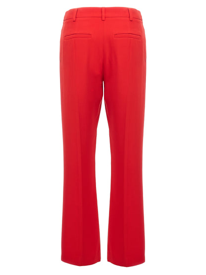 Trousers by Valentino Garavani for women in silk multicolor & red presents a perennial silhouette, meticulously tailored with a cut, long finish, and an elegant .