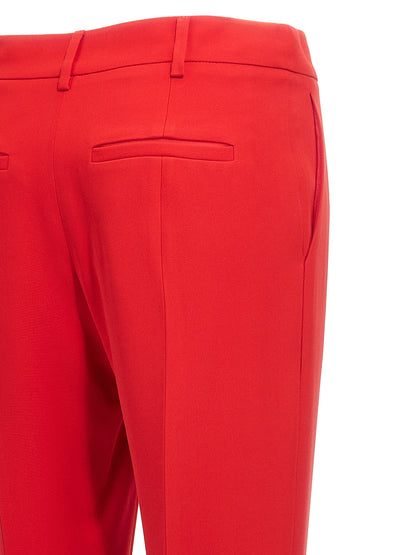 Trousers by Valentino Garavani for women in silk multicolor & red presents a smart silhouette, meticulously detailed with a smart , a smart long, and a smart .