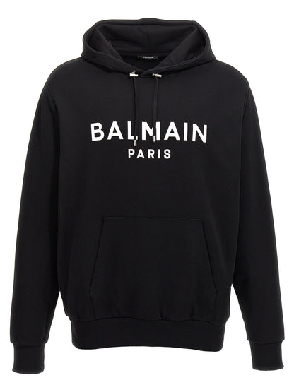Sweatshirt Hoodie by Balmain for men in organic cotton bicolour, black, white & print features a authentic silhouette, showcasing a sophisticated hooded neckline and authentic detail for a refined finish.