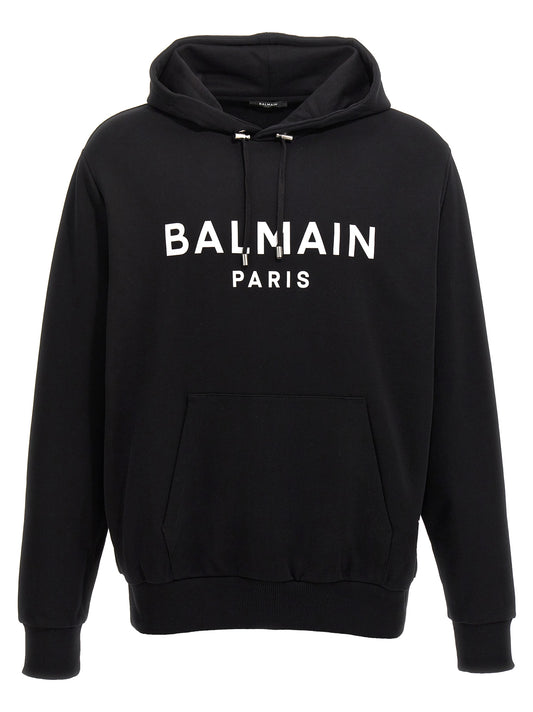 Sweatshirt Hoodie by Balmain for men in organic cotton bicolour, black, white & print features a authentic silhouette, showcasing a sophisticated hooded neckline and authentic detail for a refined finish.