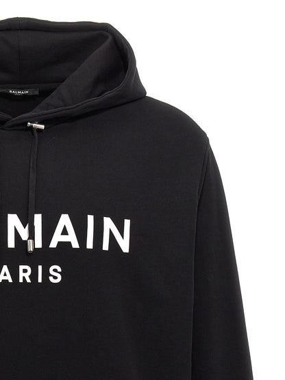 Sweatshirt Hoodie by Balmain for men in organic cotton bicolour, black, white & print features a edgy silhouette, detailed with a edgy hooded neckline and for a refined finish.