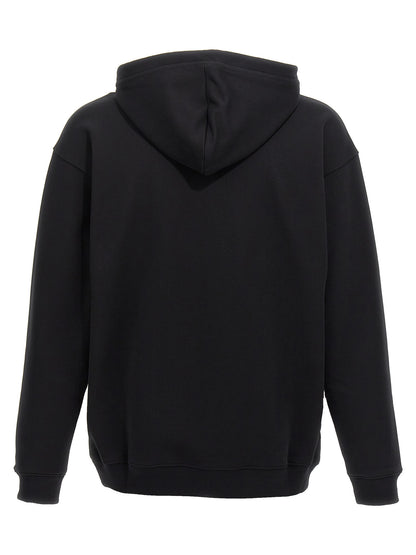 Sweatshirt Hoodie by Moschino for men in cotton bicolour, black, white & print features an avant-garde silhouette, showcasing a sophisticated hooded neckline and detail for a truly avant-garde finish.