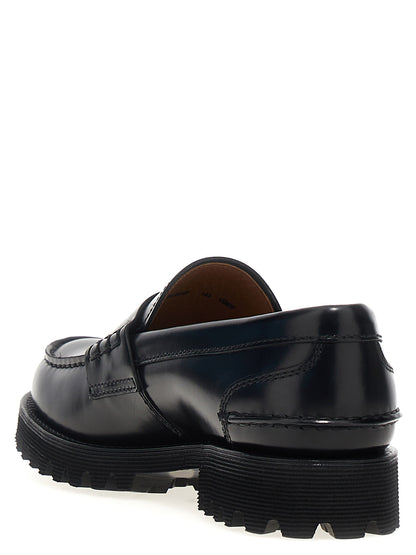 Flat Loafer Slip-On Work Shoes by Church's for women in bos taurus cowhide leather black features an effortless chic silhouette, showcasing the Play Women's Bos Taurus Cowhide Leather Flat Loafer Slip-On Work Shoes design with an effortless chic flat and a for a effortless chic look.
