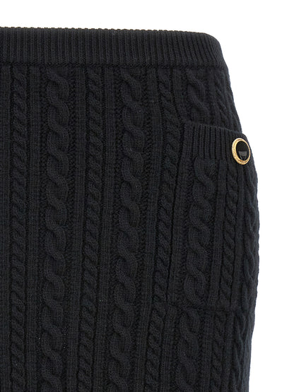 Skirt by Alessandra Rich for women in wool black showcases a sultry silhouette, elegantly defined by its maxi long and the sophisticated sultry design of the Women's Wool Maxi Long Skirt.
