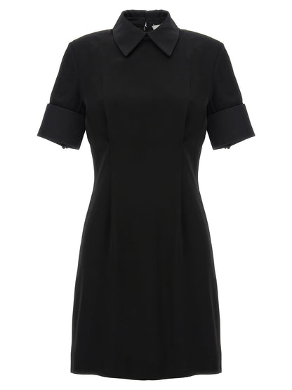 Dress by Sportmax for women in satin viscose black features an eye catching silhouette with a sophisticated , elegant , and a refined short mini for a eye catching aesthetic.