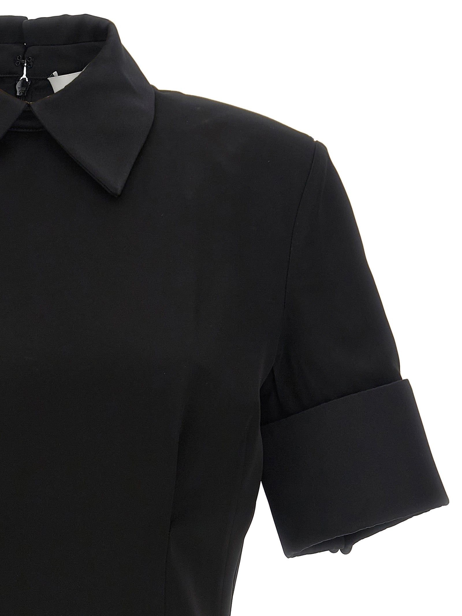 Dress by Sportmax for women in satin viscose black features an magnificent silhouette, artfully detailed with a magnificent and that flows into an magnificent short mini.