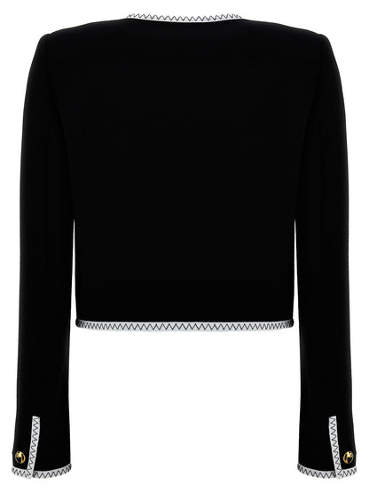 Overcoat by Moschino for women in viscose wool crepe bicolour, black & white features a contemporary silhouette showcasing a contemporary and refined pockets & insulated for a sophisticated finish.