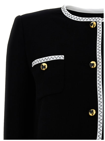 Overcoat by Moschino for women in viscose wool crepe bicolour, black & white showcases a enveloping silhouette, detailed with distinctive pockets & insulated and a enveloping .