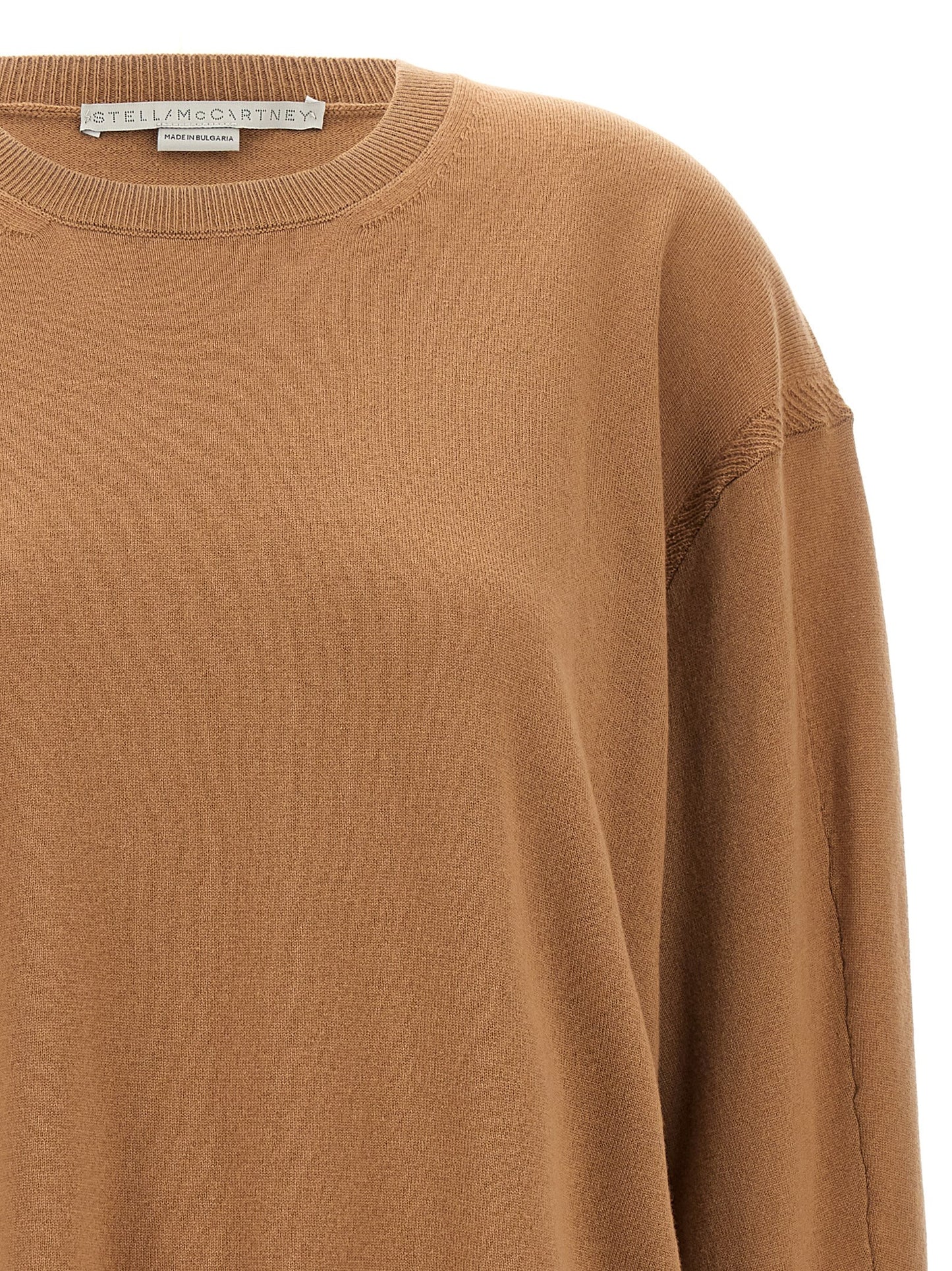 Cardigan by Stella McCartney for women in wool beige & gold features an impeccable silhouette, showcasing a sophisticated crew split neckline and detail for a truly impeccable finish.