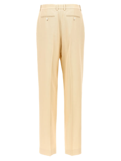 Trousers by Tom Ford for women in wool & silk beige features an sartorial silhouette, showcasing a precise and long with a sartorial for a refined look.