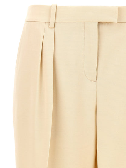 Trousers by Tom Ford for women in wool & silk beige features a tailored silhouette with a tailored , defined by its long and a sophisticated .