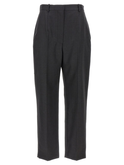 Trousers by Alexander McQueen for women in wool gray & pinstripe features an sartorial silhouette, showcasing a precise and long with a sartorial for a refined look.