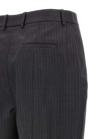Trousers by Alexander McQueen for women in wool gray & pinstripe features an on trend silhouette, showcasing a sophisticated with a long and for an on trend finish.