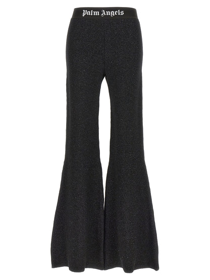 Trousers by Palm Angels for women in cashmere wool lurex & viscose black & jacquard presents a smart silhouette, meticulously detailed with a smart flared, a smart long, and a smart .
