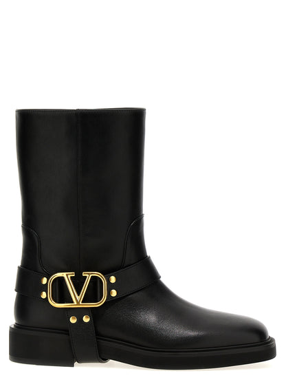 Ankle Boots by Valentino Garavani for women in calfskin leather black, gold & signature features an high-performance silhouette, showcasing the sophisticated design of the V Logo Women's Calfskin Leather Ankle Boots with a and a refined .