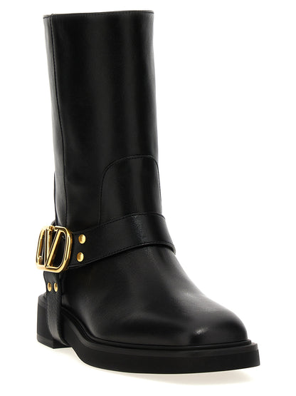Ankle Boots by Valentino Garavani for women in calfskin leather black, gold & signature features an effortless chic silhouette from the V Logo Women's Calfskin Leather Ankle Boots collection, showcasing a effortless chic and refined for an effortless chic look.