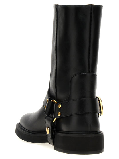 Ankle Boots by Valentino Garavani for women in calfskin leather black, gold & signature features an dynamic silhouette, showcasing the dynamic V Logo Women's Calfskin Leather Ankle Boots design with its distinctive and elegant .
