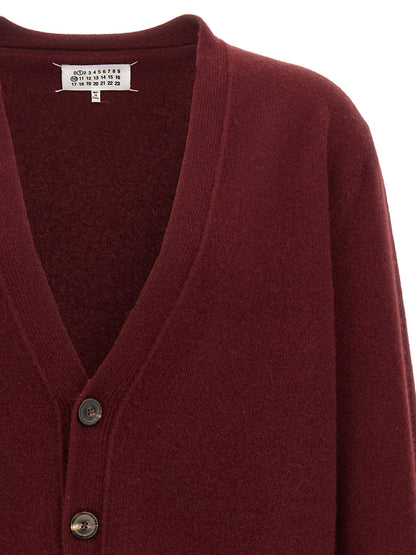Cardigan by Maison Margiela for men in wool bordeaux features a nuanced silhouette with a refined and nuanced detailing for a sophisticated look.