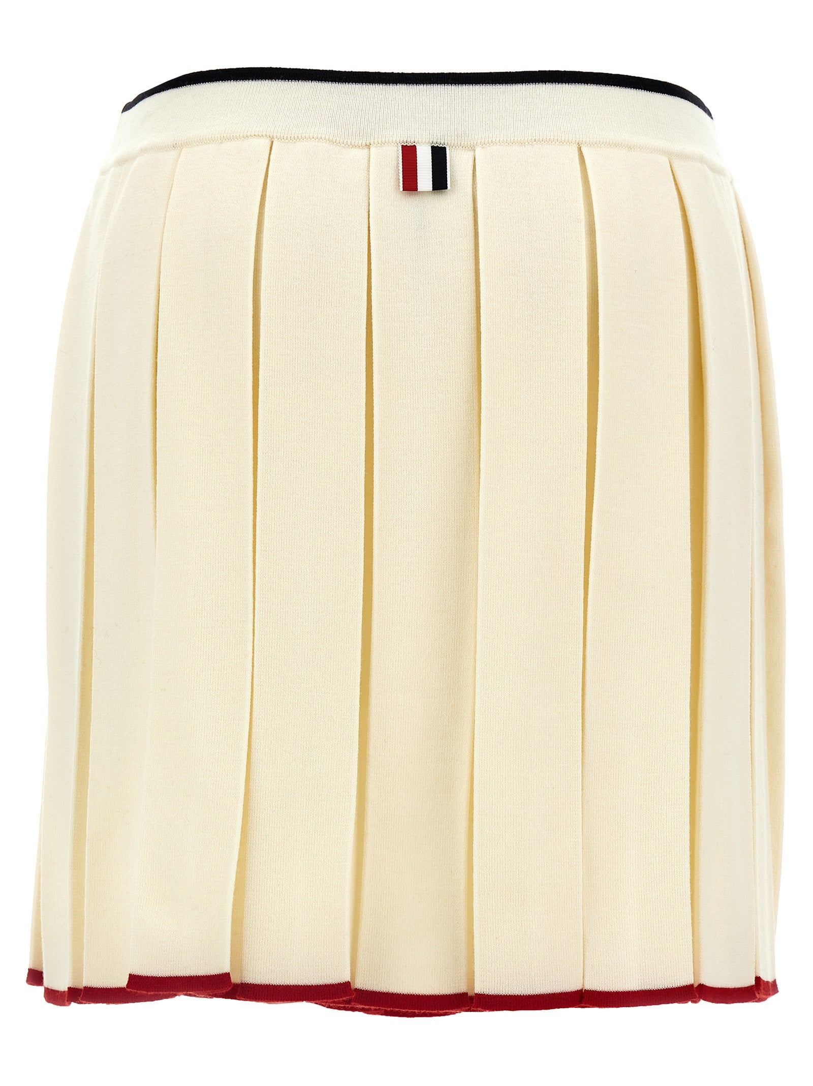 Skirt by Thom Browne for women in virgin wool & polyamide white showcases a sultry silhouette, elegantly defined by its long and the sophisticated sultry design of the Women's Pleated Virgin Wool & Polyamide Long Skirt.