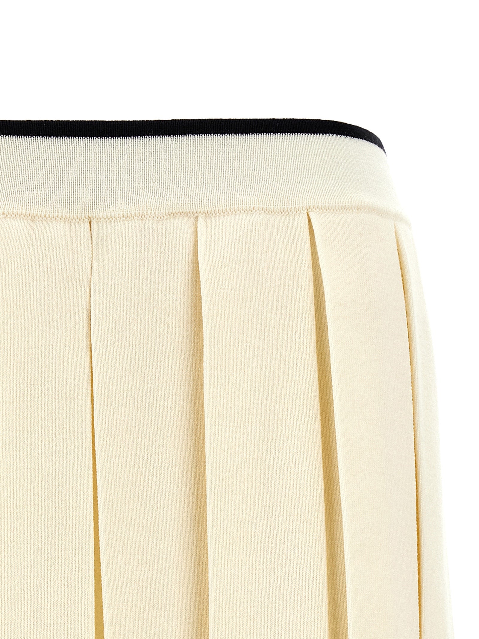 Skirt by Thom Browne for women in virgin wool & polyamide white showcases a dramatic silhouette, artfully capturing the essence of the Women's Pleated Virgin Wool & Polyamide Long Skirt in a dramatic long cut for a refined look.