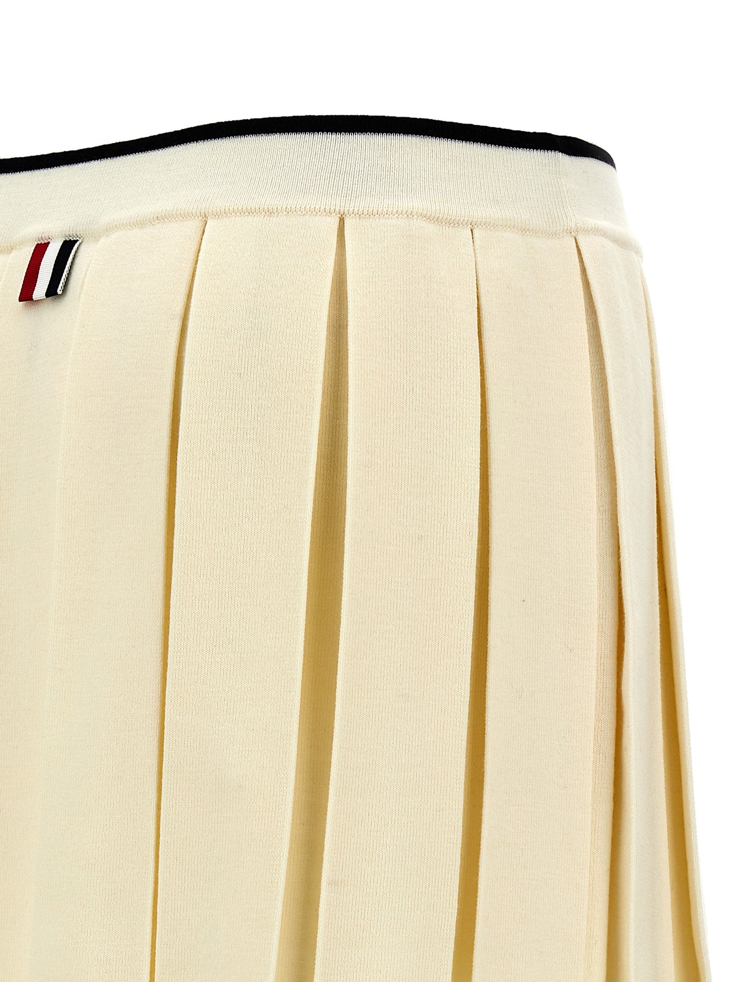 Skirt by Thom Browne for women in virgin wool & polyamide white features a captivating silhouette, showcasing the captivating Women's Pleated Virgin Wool & Polyamide Long Skirt design with a sophisticated long for a captivating look.