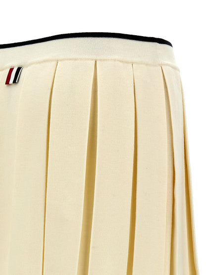 Skirt by Thom Browne for women in virgin wool & polyamide white features a captivating silhouette, showcasing the captivating Women's Pleated Virgin Wool & Polyamide Long Skirt design with a sophisticated long for a captivating look.