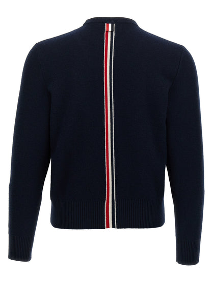 Cardigan by Thom Browne for men in virgin wool blue showcases a captivating silhouette, artfully detailed with a captivating and crew neckline for a truly sophisticated captivating look.