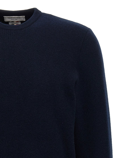 Cardigan by Thom Browne for men in virgin wool blue showcases a luxurious silhouette, meticulously detailed with a sophisticated crew neckline and for a refined finish.