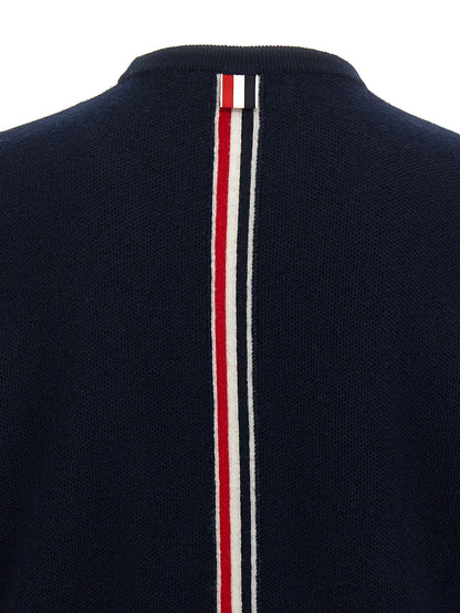 Cardigan by Thom Browne for men in virgin wool blue features an impeccable silhouette, showcasing a sophisticated and detail for a truly impeccable finish.