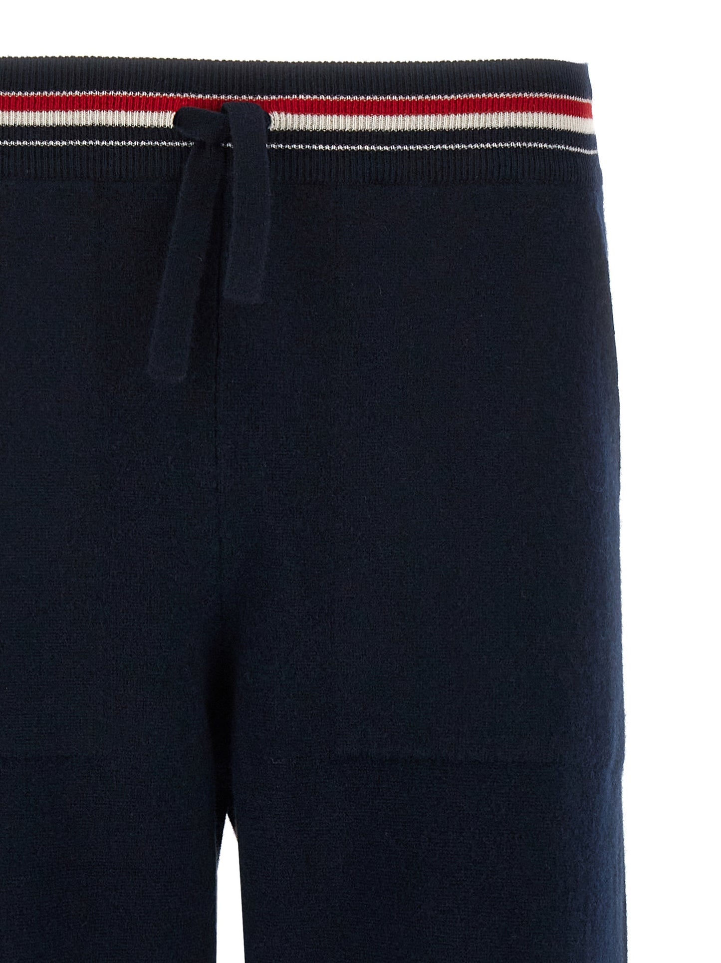 Joggers by Thom Browne for men in cashmere blue features a polished silhouette with a polished , reaching a polished long and finished with a polished .