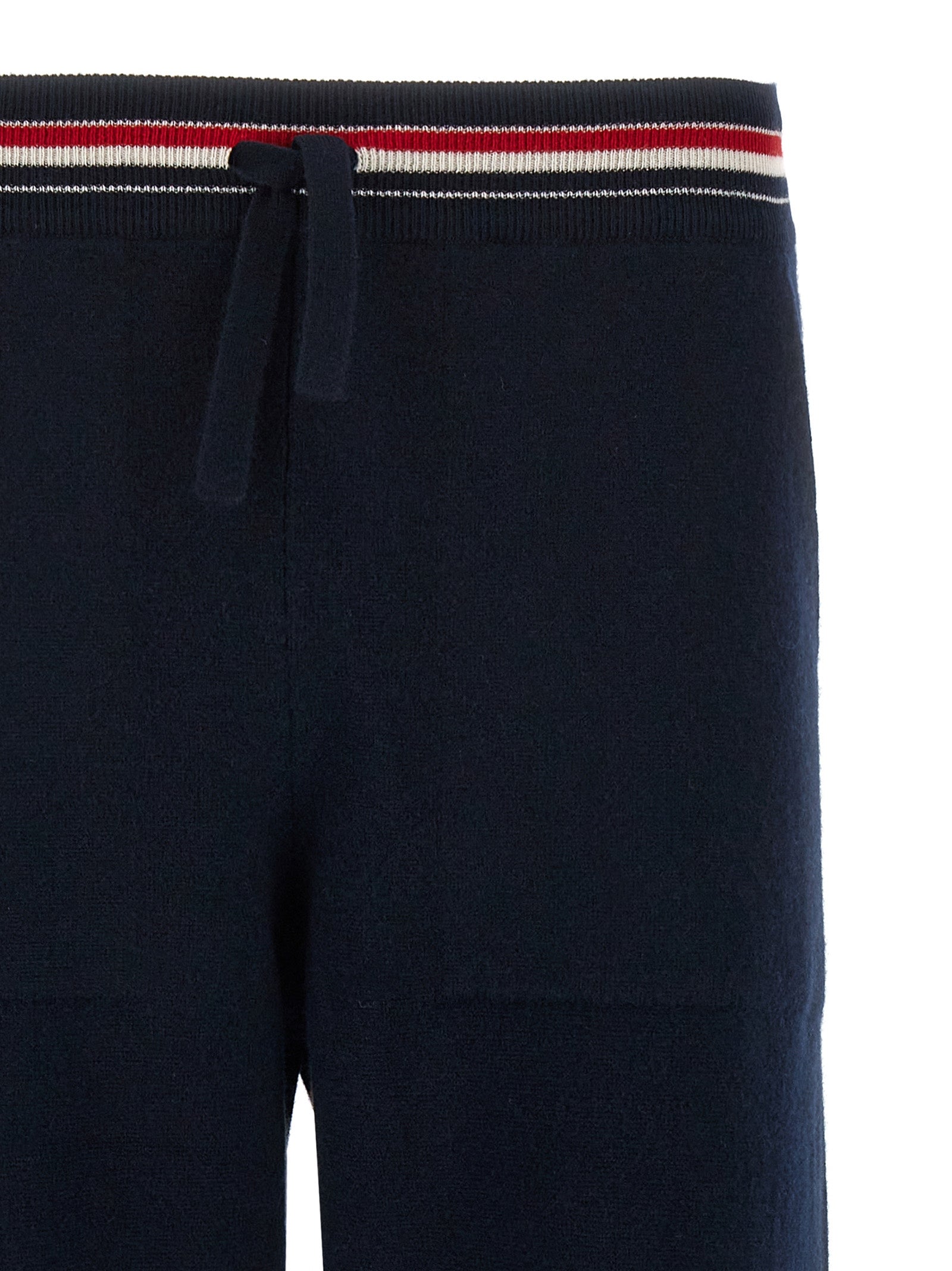 Joggers by Thom Browne for men in cashmere blue features a polished silhouette with a polished , reaching a polished long and finished with a polished .