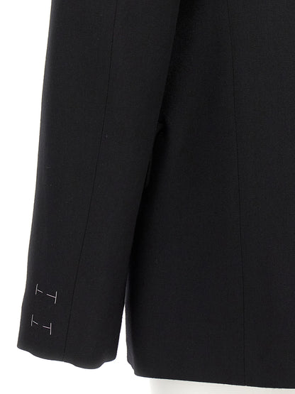 Blazer by Maison Margiela for women in wool black presents a distinguished silhouette, detailed with a distinguished and distinctive for a truly sophisticated finish.