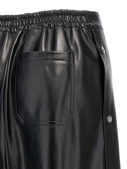 Trousers by Stella McCartney for women in polyester leather black features an sartorial silhouette, showcasing a precise wide and long with a sartorial for a refined look.
