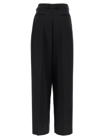 Trousers by Giuseppe Di Morabito for women in virgin wool black presents a smart silhouette, meticulously detailed with a smart straight & wide, a smart long, and a smart .