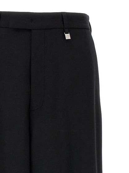 Trousers by Giuseppe Di Morabito for women in virgin wool black features a artisanal silhouette, showcasing a sophisticated straight & wide with a long and for a artisanal finish.