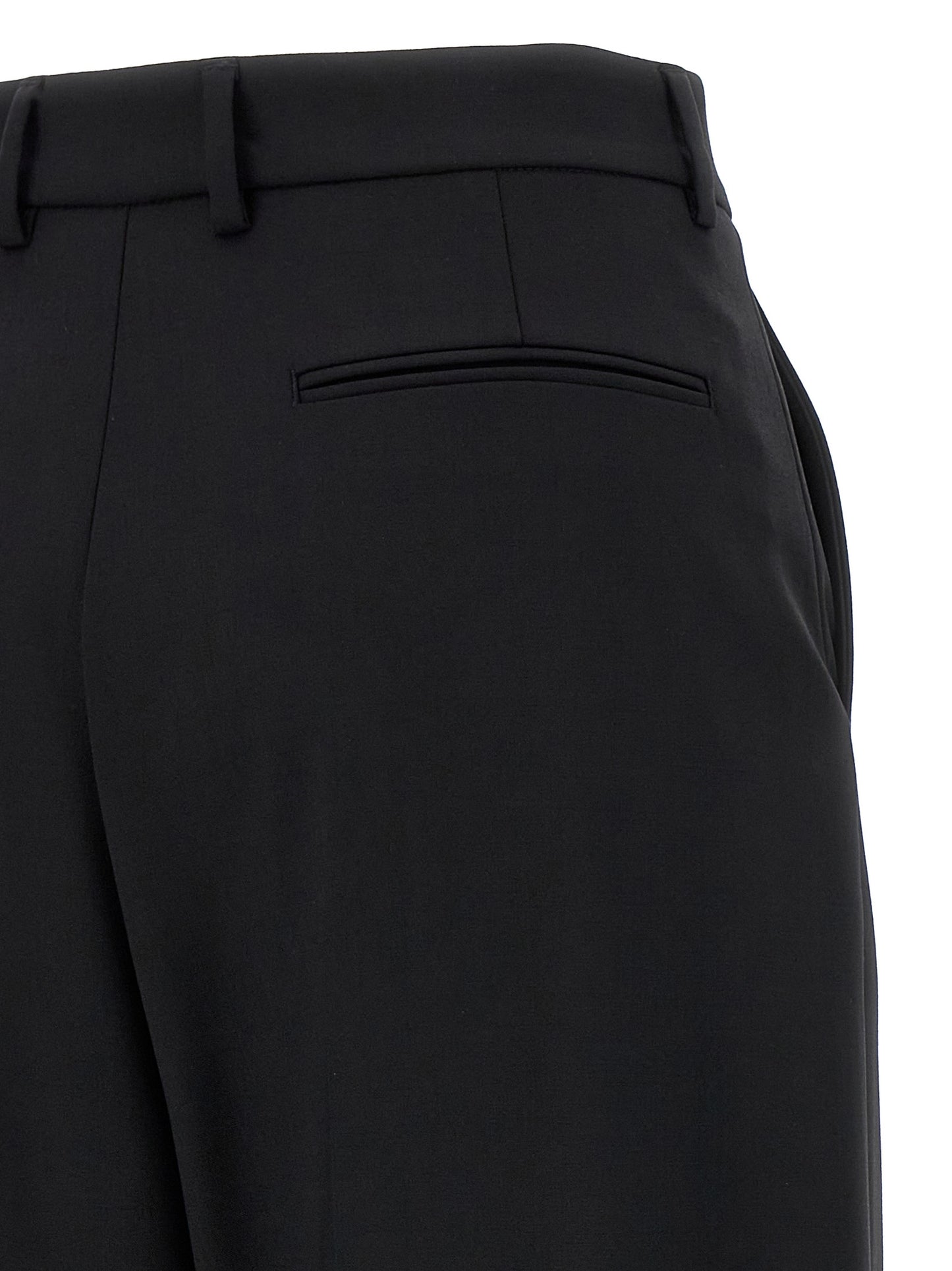 Trousers by Giuseppe Di Morabito for women in virgin wool black presents a perennial silhouette, meticulously tailored with a straight & wide cut, long finish, and an elegant .