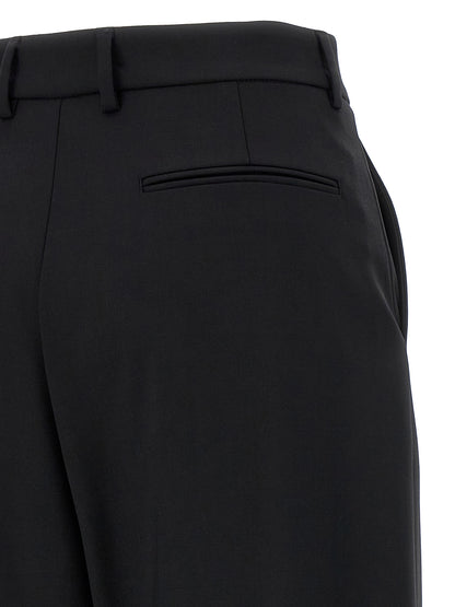 Trousers by Giuseppe Di Morabito for women in virgin wool black presents a perennial silhouette, meticulously tailored with a straight & wide cut, long finish, and an elegant .