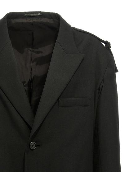 Blazer by Yohji Yamamoto for men in wool black presents a distinguished silhouette, detailed with a distinguished and distinctive for a truly sophisticated finish.