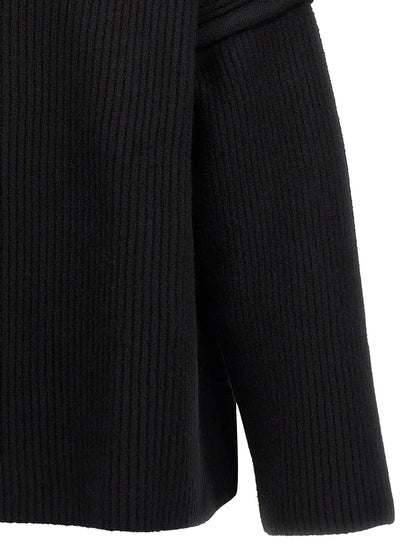 Cardigan by Jil Sander for men in wool black presents a textural silhouette, artfully finished with a textural and for a sophisticated, textural look.