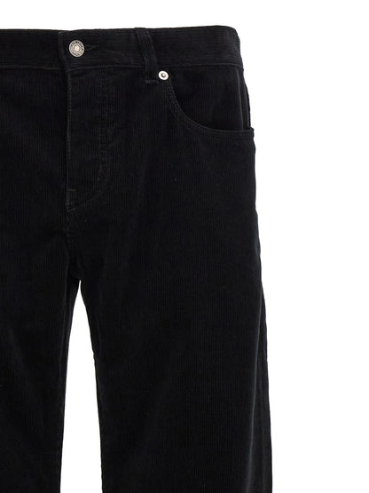 Trousers by Saint Laurent for men in cotton corduroy black presents a smart silhouette, meticulously detailed with a smart , a smart long, and a smart mid rise.