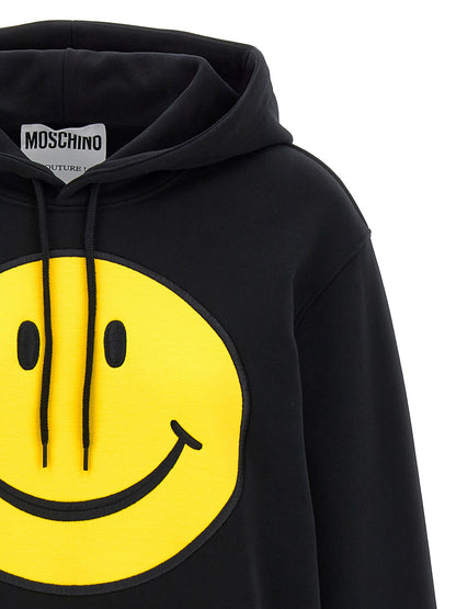 Sweatshirt Hoodie by Moschino for women in cotton black features a authentic silhouette, showcasing a sophisticated hooded neckline and authentic detail for a refined finish.