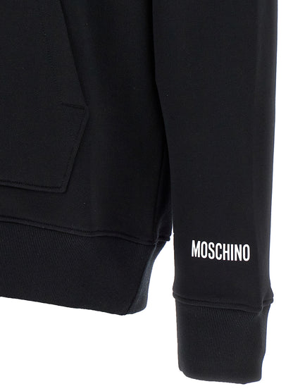 Sweatshirt Hoodie by Moschino for women in cotton black features an dramatic silhouette, showcasing a sophisticated and dramatic for a refined, modern aesthetic.