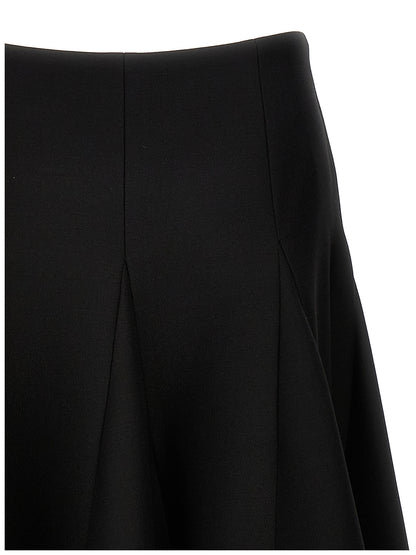 Skirt by Valentino Garavani for women in silk crepe & virgin wool black features a contoured silhouette from the Women's Silk Crepe & Virgin Wool Mini Skirt collection, characterized by its contoured mini for a contoured finish.