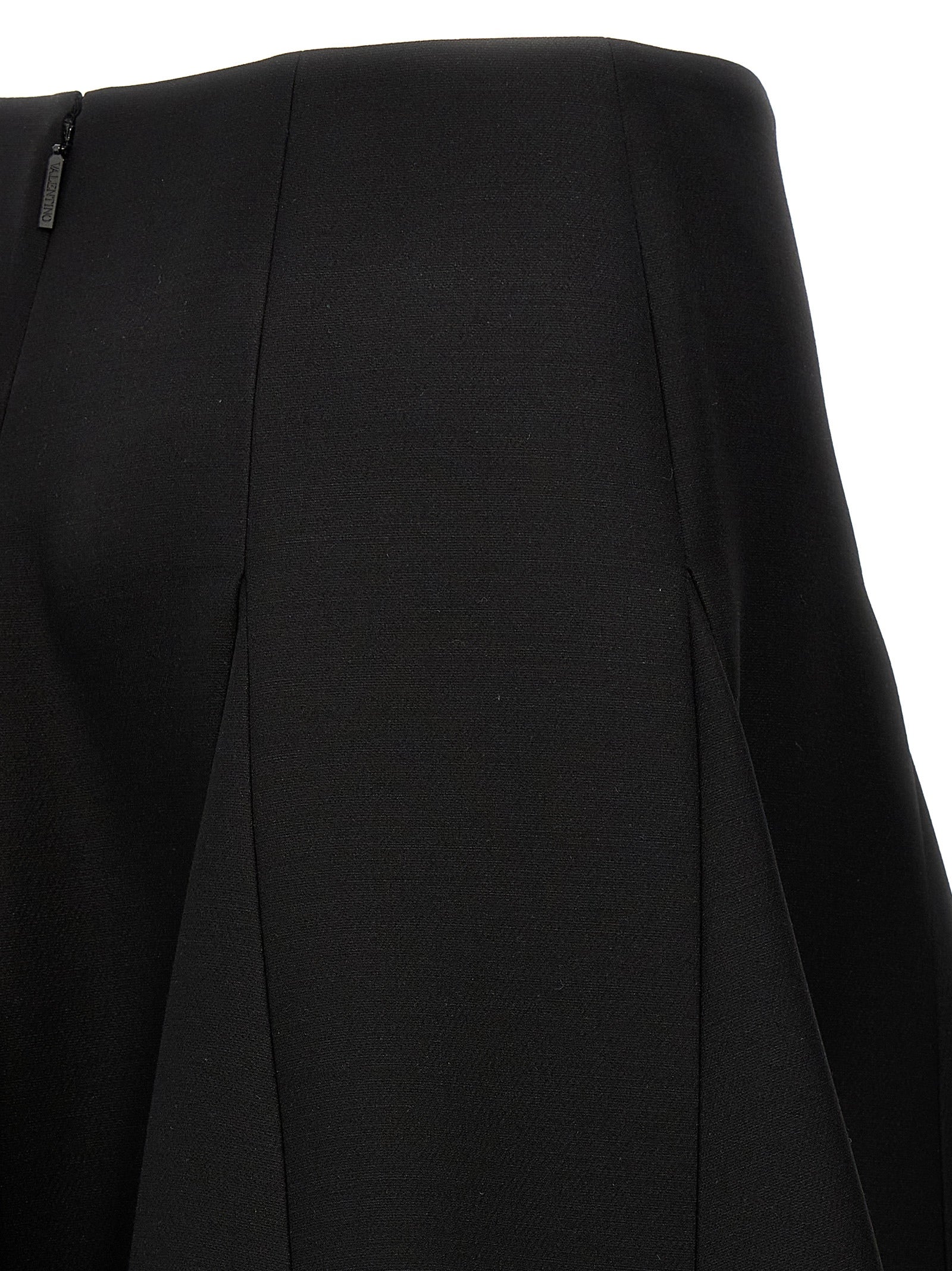 Skirt by Valentino Garavani for women in silk crepe & virgin wool black features a contoured silhouette from the Women's Silk Crepe & Virgin Wool Mini Skirt collection, characterized by its contoured mini for a contoured finish.