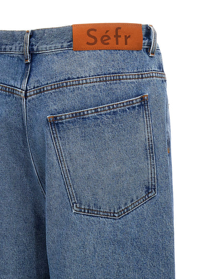 Jeans by SÉFR for men in denim cotton & suede leather blue features an sophisticated and with a precise long, creating a sophisticated and sophisticated silhouette.