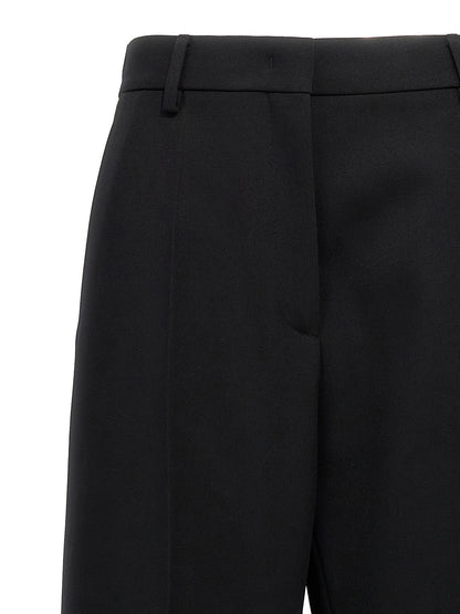 Trousers by Valentino Garavani for women in virgin wool black features a artisanal silhouette, showcasing a sophisticated straight-leg & wide with a long and for a artisanal finish.