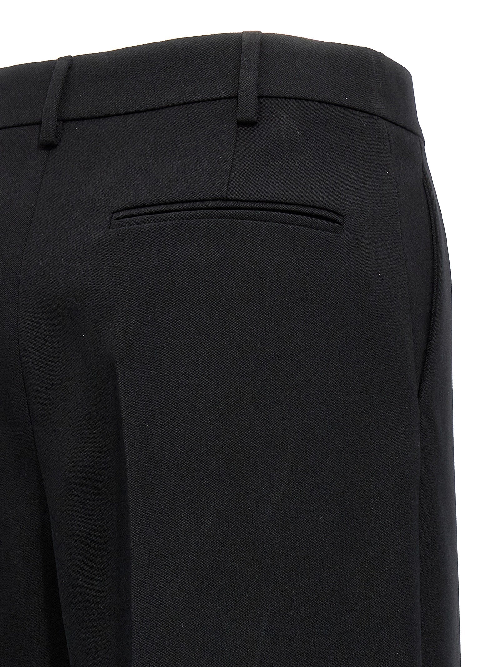 Trousers by Valentino Garavani for women in virgin wool black features an on trend silhouette, showcasing a sophisticated straight-leg & wide with a long and for an on trend finish.