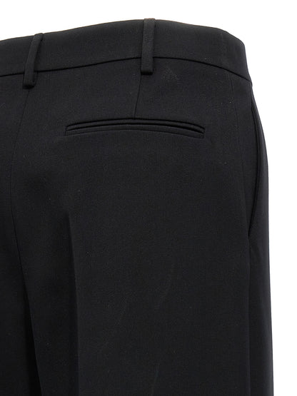 Trousers by Valentino Garavani for women in virgin wool black features an on trend silhouette, showcasing a sophisticated straight-leg & wide with a long and for an on trend finish.